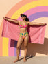 Vibrant two piece maximalist bikini with a v neck bralette top and high waisted bottom. The fabric mixes a bright yellow and hot pink gingham checkerboard with oversized neon pink and red cherries, green leaves, and semicircle watermelon shapes with white dots along the lower edge. Smooth, stretchy recycled polyester with UPF 50 sun protection and removable padding. Bold retro pop art swimwear in saturated dopamine colors, built for pool parties, vacation outfits, and fun beach days.