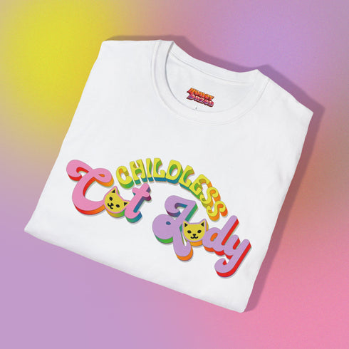 An election 2024 t-shirt with a colorful retro-style graphic that reads "Childless Cat Lady" across the chest. The text is in a playful, curvy font with each word in a different color - "Childless" in yellow-green, "Cat" in pink, and "Lady" in purple. Small cat face icons are incorporated into the letters 'a' in "Cat" and "Lady".