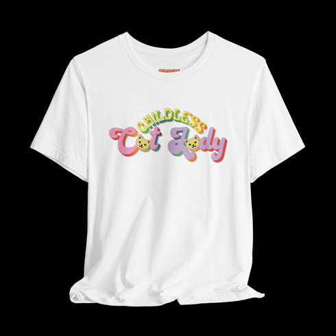 An election 2024 t-shirt with a colorful retro-style graphic that reads "Childless Cat Lady" across the chest. The text is in a playful, curvy font with each word in a different color - "Childless" in yellow-green, "Cat" in pink, and "Lady" in purple. Small cat face icons are incorporated into the letters 'a' in "Cat" and "Lady".