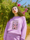 Comfort Colors garment-dyed sweatshirt featuring 'Patriarchy Slayer' design with pink armored knight holding sword and banner reading 'Burn It Down', surrounded by decorative floral border with roses and leaves. Made from 80% ring-spun cotton and 20% polyester with relaxed fit and rolled-forward shoulders. Available in lavender purple and seafoam green colorways, sizes S-3XL unisex, featuring sustainable made-to-order production with OEKO-TEX certified low-impact dyes and zero waste manufacturing process.