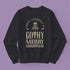 Black sweatshirt with "Have yourself a Gothy Merry Christmas" text and skull wearing Santa hat. Bats and ornate designs surround the skull.