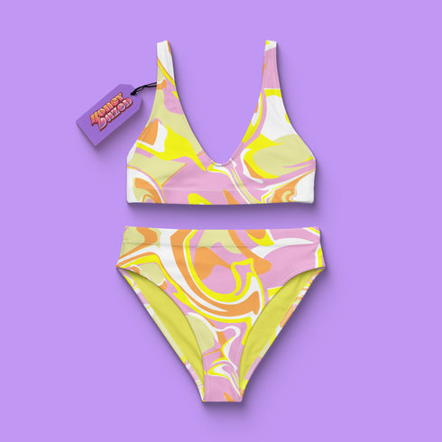 A pastel marble print two-piece bikini with high-waist bottoms and removable padding, featuring swirly designs in pink, yellow, and orange, available in sizes XS to 3X.