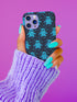 Black phone case featuring bright teal textured ghost pattern with matching star accents. Kawaii-style ghosts with simple black eyes on dark background.