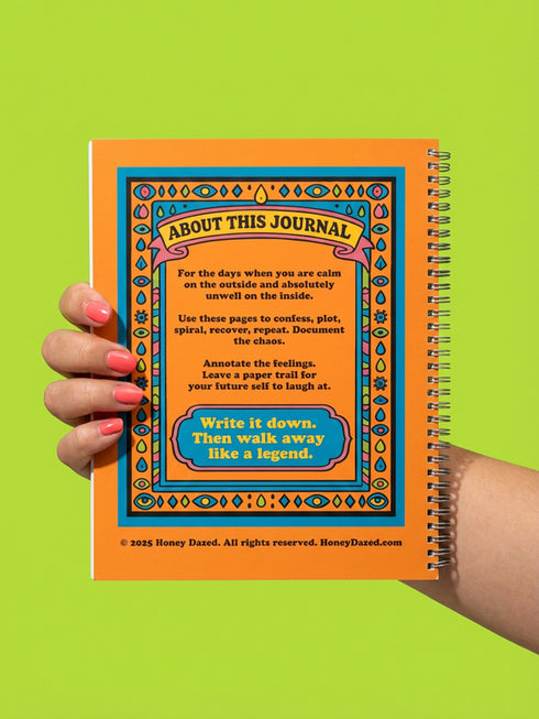 Undated weekly planner with hardcover and metal wire-o spiral binding options in black or gold. Cover features retro pop art illustration of a three-eyed woman crying while holding wine and tissues, with text Scheduled Hysteria. Vibrant orange background with psychedelic blue and purple patterns. Open planner shows flexible weekly layout on high-quality 60lb paper. Lays flat for easy writing. Ideal for ADHD organization, funny mental health gifts, and maximalist desk decor. Satin matte finish.