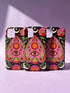 Black phone case featuring a faux embroidery style print with a central pink planchette design. The planchette contains a single eye motif and a circular sun element above it. Surrounding the design are orange, red, and pink flowers, green leaves, small cream stars, and crescent moons. The print creates a stitched textile illusion on a smooth matte protective case with dual layer construction.