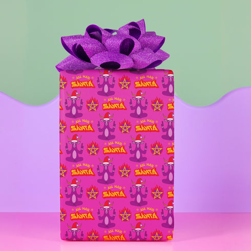 Vibrant pink wrapping paper featuring Occult symbol Baphomet Santas throwing horns, surrounded by flaming pentagrams and "All Hail Santa" text. A punk rock twist on Christmas gift wrap.