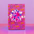 Vibrant pink wrapping paper featuring Occult symbol Baphomet Santas throwing horns, surrounded by flaming pentagrams and "All Hail Santa" text. A punk rock twist on Christmas gift wrap.