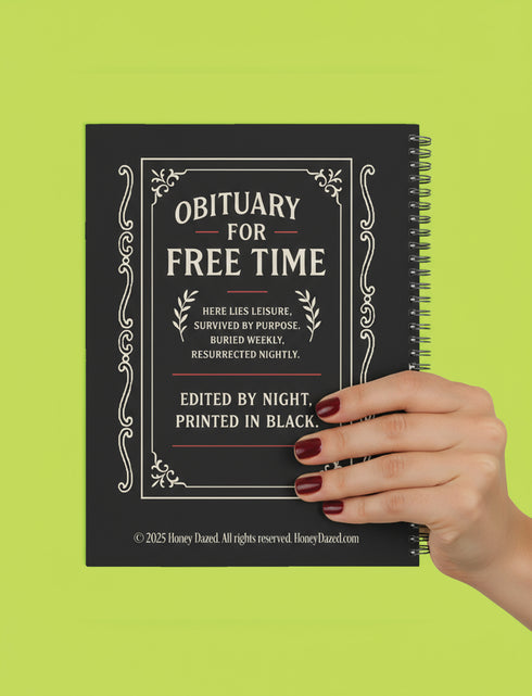 An 8.5 x 11 inch black hardcover spiral planner with a durable satin matte laminated finish. The front cover features a vintage-style white ornamental border, creating a gothic, macabre aesthetic. Inside the frame, the title "Calendar of Doom" is printed in an antique serif font. This undated weekly and monthly agenda is shown with a metal wire-o spiral binding on the right side. The design uses a black, white, and red color scheme, making it a unique piece of dark humor stationery