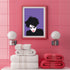 A minimalist portrait of Robert Smith from The Cure against a purple background. The image shows his signature wild black hair, pale white face, and iconic red lipstick in a simplified, high-contrast style. His head is slightly tilted downward in his characteristic brooding pose.