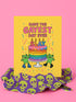 5x7 inch birthday greeting card with a yellow background featuring the phrase “Have the Gayest Day Ever” in bold pink text, a rainbow birthday cake with candles spelling “SLAY,” and two green frogs wearing colorful platform boots. Card includes confetti details and a white envelope. Printed on 120lb silk cover stock. The inside message reads: “Sashay into this new age with zero regrets and maximum glitter.”