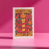 5x7 inch birthday greeting card featuring a bold psychedelic design with a snake wrapped around a melting candle, flames, mushrooms, and planets in red, orange, and pink tones. The card includes a white envelope and an interior message that reads, "One more year of burning brighter and giving zero f*cks." Printed on glossy silk stock.