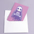 Birthday card featuring a cute cartoon grim reaper holding a birthday cake on pink background. The reaper wears a purple cloak and has a white skull face. It's carrying a small purple cake with three lit candles. The reaper's cloak drips like melting icing at the bottom. Ideal for Halloween birthdays or gothic-themed celebrations. Inside greeting: "Hope your B-day is spooky AF and sweet as cake!"