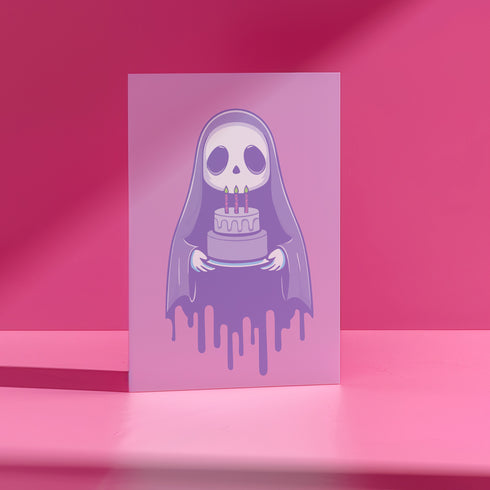 Birthday card featuring a cute cartoon grim reaper holding a birthday cake on pink background. The reaper wears a purple cloak and has a white skull face. It's carrying a small purple cake with three lit candles. The reaper's cloak drips like melting icing at the bottom. Ideal for Halloween birthdays or gothic-themed celebrations. Inside greeting: "Hope your B-day is spooky AF and sweet as cake!"