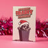 A playful holiday card featuring a raccoon wearing a Santa hat, popping out of a trash can with a mischievous grin. The text above reads "Have Yourself a Trashy Little Christmas" in bold, dripping letters. The card combines humor with a grungy, festive theme for a lighthearted take on the holiday season.