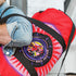 Red cylindrical roller skating duffle bag with black straps, featuring a prominent circular emblem with a colorful Baphomet design and "Hail Skatin" text. Includes mesh side pocket and adjustable padded shoulder strap.