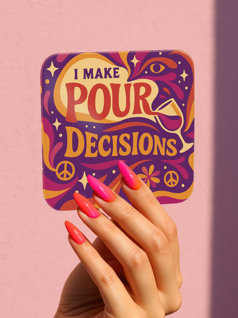 A 4-piece retro coaster set featuring colorful 70s-style cocktail graphics with playful drink quotes: "More Bubbles Less Trouble," "I Make Pour Decisions," "Cabernet All Day," and "Call Me Old-Fashioned." These 3.75” square coasters are made of Masonite with a glossy finish and cork backing—perfect for funky bar carts, dopamine décor, and retro hostess gifts.