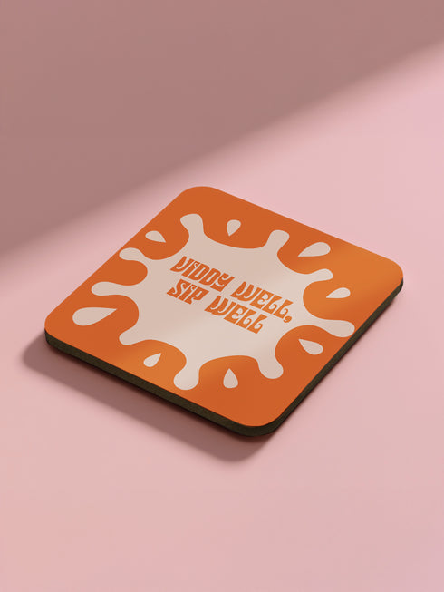 Set of four square coasters featuring iconic imagery from "A Clockwork Orange" in orange and white designs on a pink background.