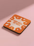 Set of four square coasters featuring iconic imagery from "A Clockwork Orange" in orange and white designs on a pink background.