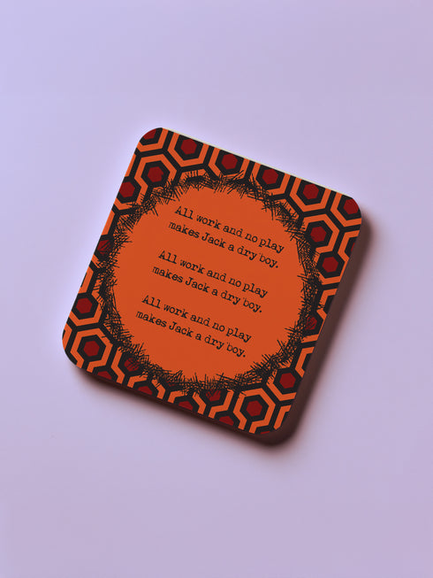 Four-piece horror movie coaster set featuring The Shining and Carrie designs in black, red, and orange with iconic quotes and imagery from the films. Cork-backed hardboard construction.
