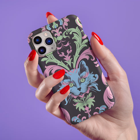 Phone case featuring baroque-style blue cat with green eyes surrounded by mint green foliage and pink flourishes on black background, Victorian-inspired desig