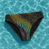 High-waisted bikini bottom featuring a holographic snake scale print with neon rainbow tones on a sleek black background. Iridescent hexagon patterns add a futuristic edge. Cheeky fit with a double-layered finish, styled poolside against a bright turquoise water backdrop. Perfect for rave-ready swim looks, alternative beachwear, and bold festival swimwear with a Y2K cyberpunk twist.