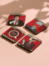 Four square coasters featuring Twin Peaks-inspired designs: Agent Cooper, the Log Lady, a coffee cup, and a mysterious blonde. Bold red backgrounds with black and white zigzag borders.