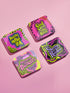 A four-piece punk rock-inspired coaster set featuring neon pink, yellow, and black designs with bold typography and chaotic patterns.