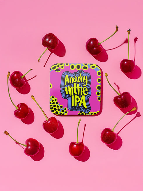 A four-piece punk rock-inspired coaster set featuring neon pink, yellow, and black designs with bold typography and chaotic patterns.