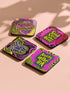 A four-piece punk rock-inspired coaster set featuring neon pink, yellow, and black designs with bold typography and chaotic patterns.