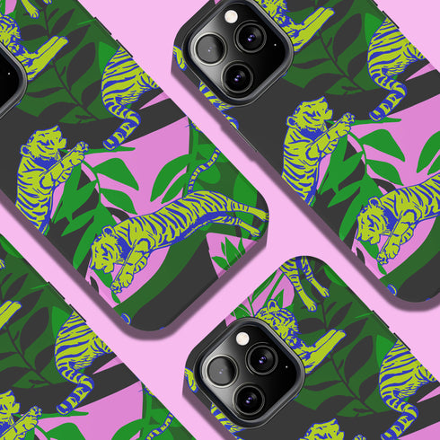 Colorful maximalist phone case with electric yellow tigers prowling through lush green tropical foliage. Psychedelic jungle theme on a purple backdrop. Bold summer design.
