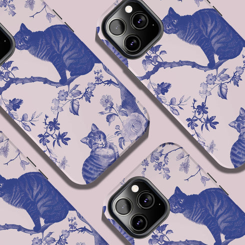 Phone case featuring a blue and pink toile pattern with cats, flowers, and botanical designs. Dual-layer protection available in glossy or matte finish.