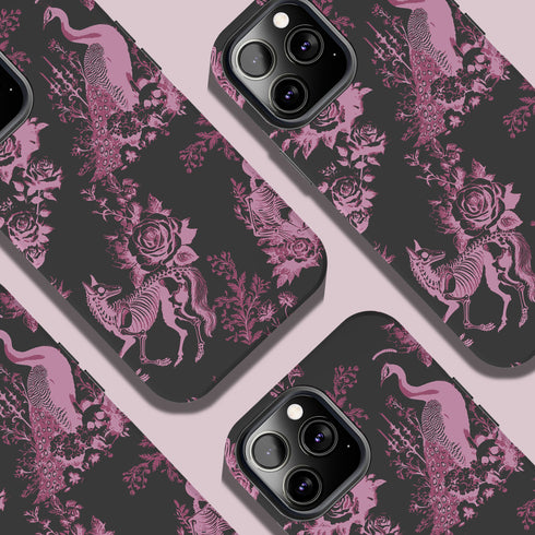 Gothic phone case featuring Victorian toile pattern in dusty rose pink on charcoal background, with skeleton unicorns, peacocks, roses, and botanical elements.
