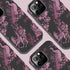 Gothic phone case featuring Victorian toile pattern in dusty rose pink on charcoal background, with skeleton unicorns, peacocks, roses, and botanical elements.