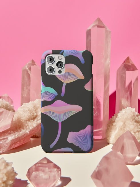 Aesthetic phone case featuring pastel neon mushrooms on a black background. The botanical-inspired design is available for iPhone, Samsung, and Google Pixel models. Glossy or matte finish options with durable, dual-layer protection.