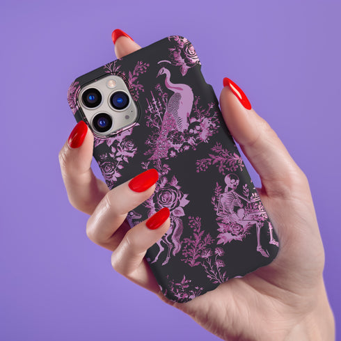 Gothic phone case featuring Victorian toile pattern in dusty rose pink on charcoal background, with skeleton unicorns, peacocks, roses, and botanical elements.