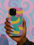 Vibrant retro phone case featuring bold yellow bananas and teal circles with black polka dots on bright pink purple background. Psychedelic fruit pattern protective phone cover with groovy 70s aesthetic perfect for iPhone Samsung Galaxy Pixel models. Colorful maximalist design with Memphis style geometric shapes dotted texture trendy tech accessory.