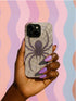 Gothic phone case featuring purple spider web design with detailed black spider on stained glass background with rose accents. Spooky Halloween phone cover with intricate web pattern and gothic aesthetic perfect for iPhone Samsung Galaxy Pixel models. Dark romantic phone protection with vintage stained glass mosaic style spider web art and floral elements.