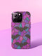 A protective phone case featuring a stained glass-style design in shades of purple, blue, and pink, with black bats flying across geometric panels outlined in gold. The case has a smooth matte finish and fits a triple-camera smartphone model.