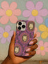 Pastel goth phone case with baroque cameo-style white cat heads framed by pearls and purple florals on a violet background; available for iPhone, Samsung, and Pixel models