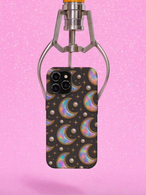 Matte or glossy phone case featuring holographic crescent moons, gold stars, and pearl accents on a black background; available for iPhone, Samsung, and Pixel models
