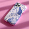 Phone case featuring a blue and pink toile pattern with cats, flowers, and botanical designs. Dual-layer protection available in glossy or matte finish.