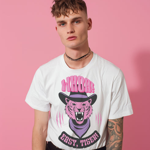 Unisex t-shirt featuring a pink tiger in purple hat and bandana, with "WHOA!" and "EASY TIGER!" text in bold retro style. Available in black and white, sizes S-3XL