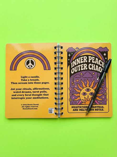 A glossy 5x7 inch spiral bound notebook featuring the phrase Inner Peace Outer Chaos in retro 70s typography. The cover showcases a vibrant psychedelic design on a mustard yellow background with a central trippy sun motif containing three mystical eyes. Below the sun, text reads Meditations, Mantras, and Meltdown Notes in bold black font. The journal has a durable black metal spiral binding and contains 150 lined pages for writing, shadow work, or daily planning.