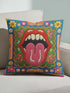 Maximalist throw pillow cover featuring a printed faux embroidery design with red open lips, pink tongue, white teeth, green scalloped medallion border, yellow and pink flowers, and decorative folk-inspired bands on a bright blue background with hot pink edging. Square colorful pillowcase for eclectic home decor, retro interiors, dopamine decor, boho living rooms, statement sofas, beds, chairs, and reading nooks.