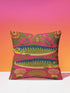 A square throw pillow cover featuring a symmetrical maximalist design on a hot pink background. Two stylized green and blue sardines swim in opposite directions in the center, featuring detailed scales and yellow eyes. The fish are surrounded by a folk art style pattern of green leafy vines and stylized orange and yellow flowers at the corners. The fabric has a faux linen texture with a flat printed design that mimics the look of vintage embroidery. Vibrant colors include pink, green, blue.