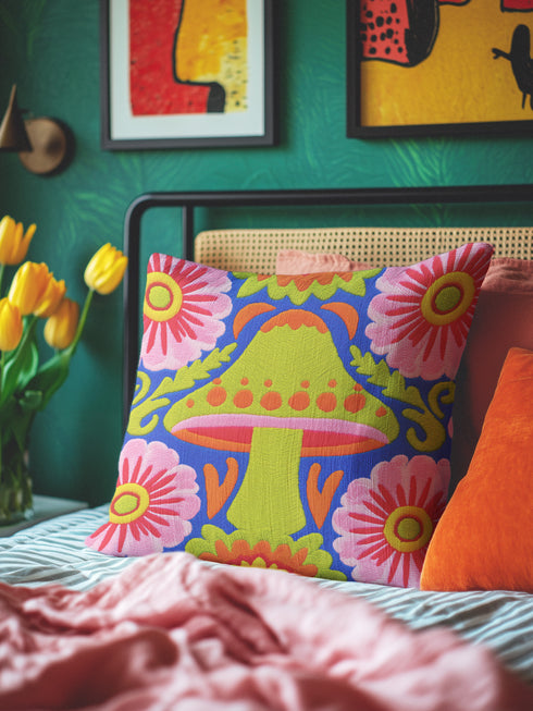 A square throw pillow cover featuring a detailed maximalist baroque mushroom design on a dark background. The pattern displays vibrant orange, red, and purple toadstools intertwined with green ferns and vintage botanical foliage. The style combines dark cottagecore with psychedelic art. The fabric possesses a premium linen texture visible in the close-up. The print appears on both sides. A hidden zipper sits at the bottom seam. The pillow is shown as a case only without an insert inside.