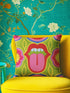 A square decorative throw pillow cover featuring a bold, symmetrical pop art design of an open mouth with bright red lips, white teeth, and a pink tongue sticking out. The central graphic is set against a lime green background surrounded by abstract geometric and floral shapes in vibrant hues of pink, yellow, and cornflower blue. The fabric has a visible premium linen-like woven texture. The colorful retro illustration is printed on both sides of the pillowcase.