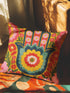 A square decorative throw pillow featuring a vibrant Hamsa hand and Evil Eye design on a hot pink background. The maximalist print includes bold blue, red, and green protection symbols with intricate details, offering a retro 70s and eclectic aesthetic. The fabric has a high-end linen texture with a hidden zipper. Available in 18x18 and 22x22 sizes.