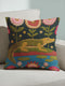 A vibrant square throw pillow cover featuring a green alligator illustration on a dark charcoal background. The design mimics the texture of vintage needlepoint embroidery on faux linen fabric. The alligator is accented with lime green scales and hot pink floral and lip motifs, creating a maximalist junglecore aesthetic. The pillow is shown on a furniture piece, highlighting the vivid cherry red and neon accents typical of dopamine decor and swampcore styles.