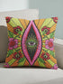 Black square pillow cover with a central eye medallion set inside a pink almond shaped mandorla. The psychedelic design surrounds the eye with red floral motifs, green leaves, and radiant orange and yellow sunburst rays. The smooth, linen-feel polyester print mimics high fidelity embroidery texture with no raised stitching. Divine feminine and sacred feminine eye pillow case, a feminist maximalist and whimsigoth cushion cover on a bold high-contrast black ground.